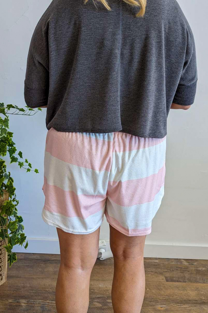 Terry cloth material with Drawstring and elastic waistband shorts. Cute Pink and White Stripe with pockets.