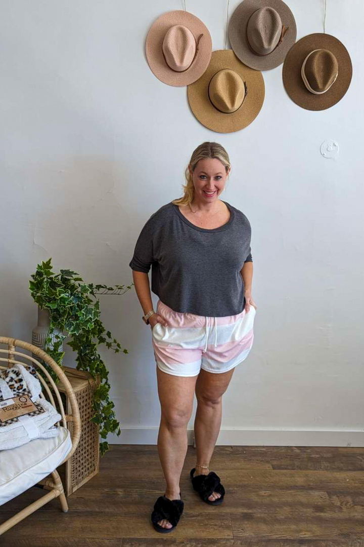 Terry cloth material with Drawstring and elastic waistband shorts. Cute Pink and White Stripe with pockets.