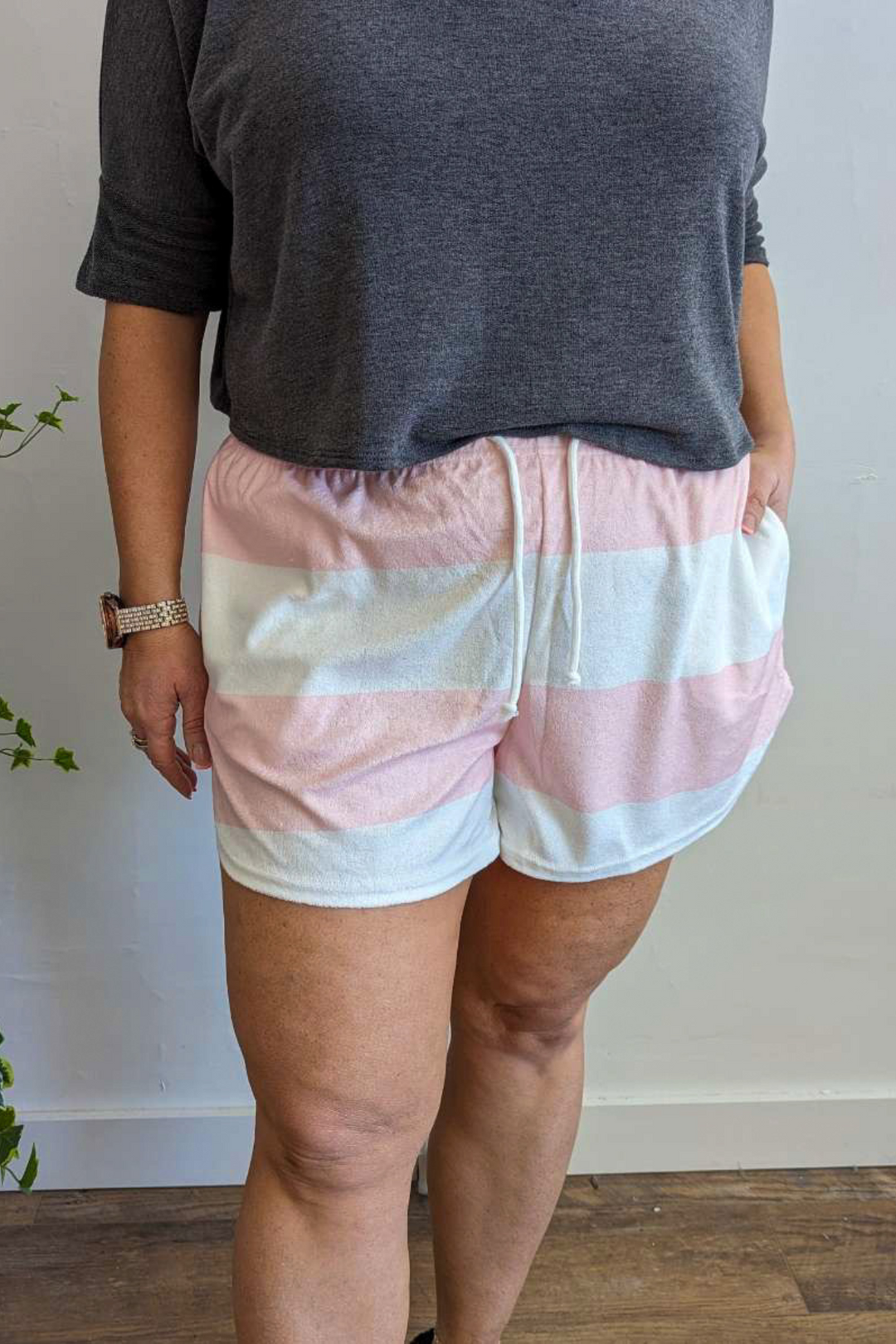 Terry cloth material with Drawstring and elastic waistband shorts. Cute Pink and White Stripe with pockets.