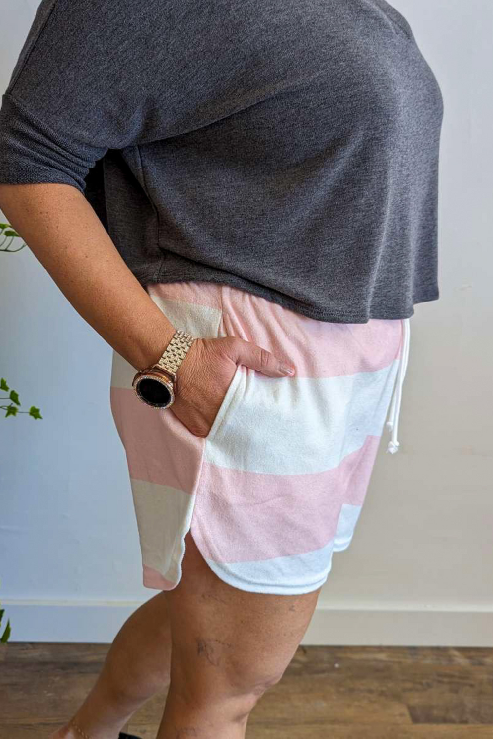 Terry cloth material with Drawstring and elastic waistband shorts. Cute Pink and White Stripe with pockets.