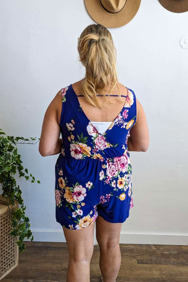 Beautiful Bright Vibrant Blue Floral Romper with short sleeves, v-neck front and v-neck back, soft stretchy fabric perfect for Summer/Spring and vacations.