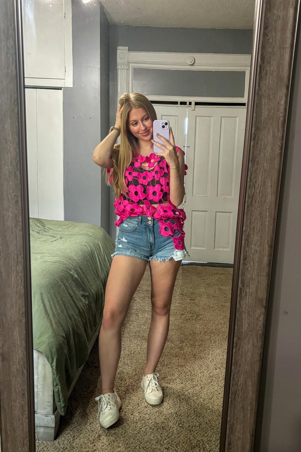 Pink Crochet Sleeveless Top with a V shape bottom.