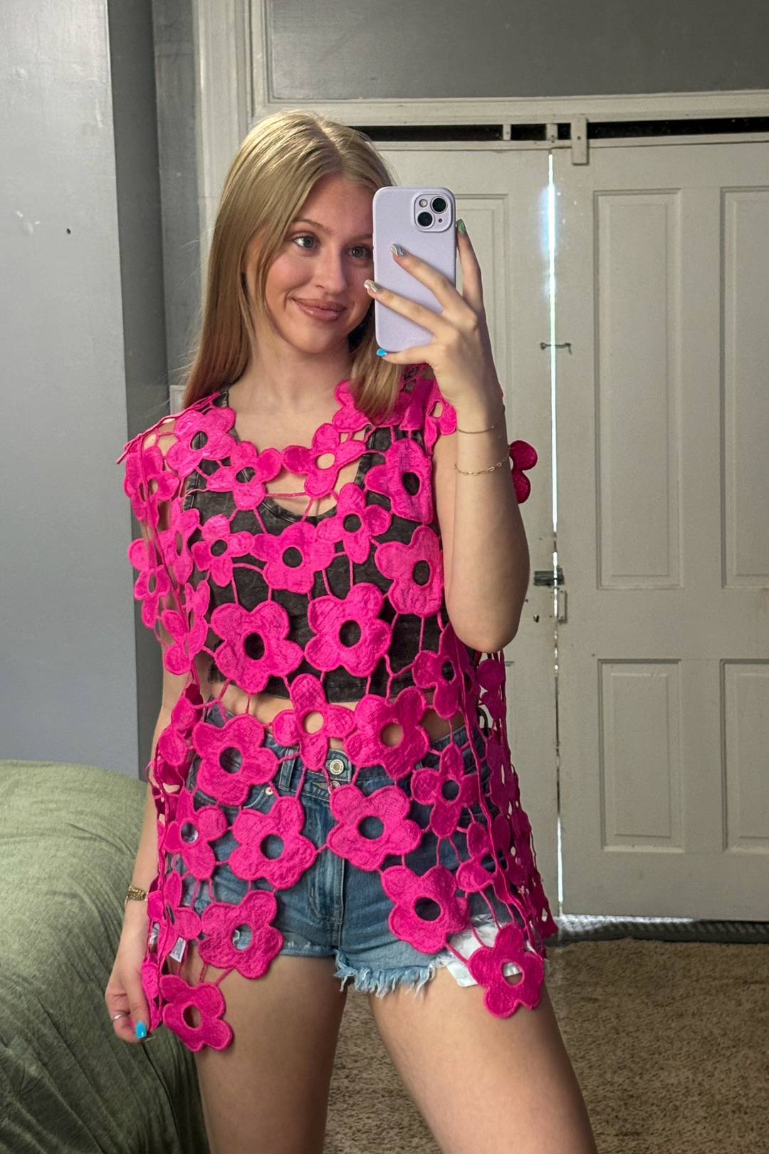 Pink Crochet Sleeveless Top with a V shape bottom.